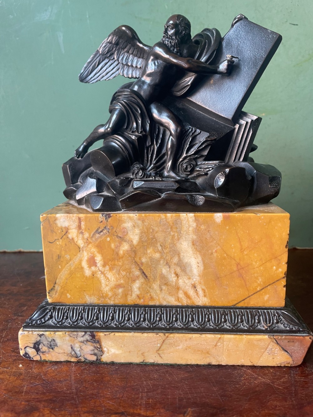 Early C19th French classical bronze study mounted on a ‘giallo di siena’ marble plinth base , probably depicting Chronos .