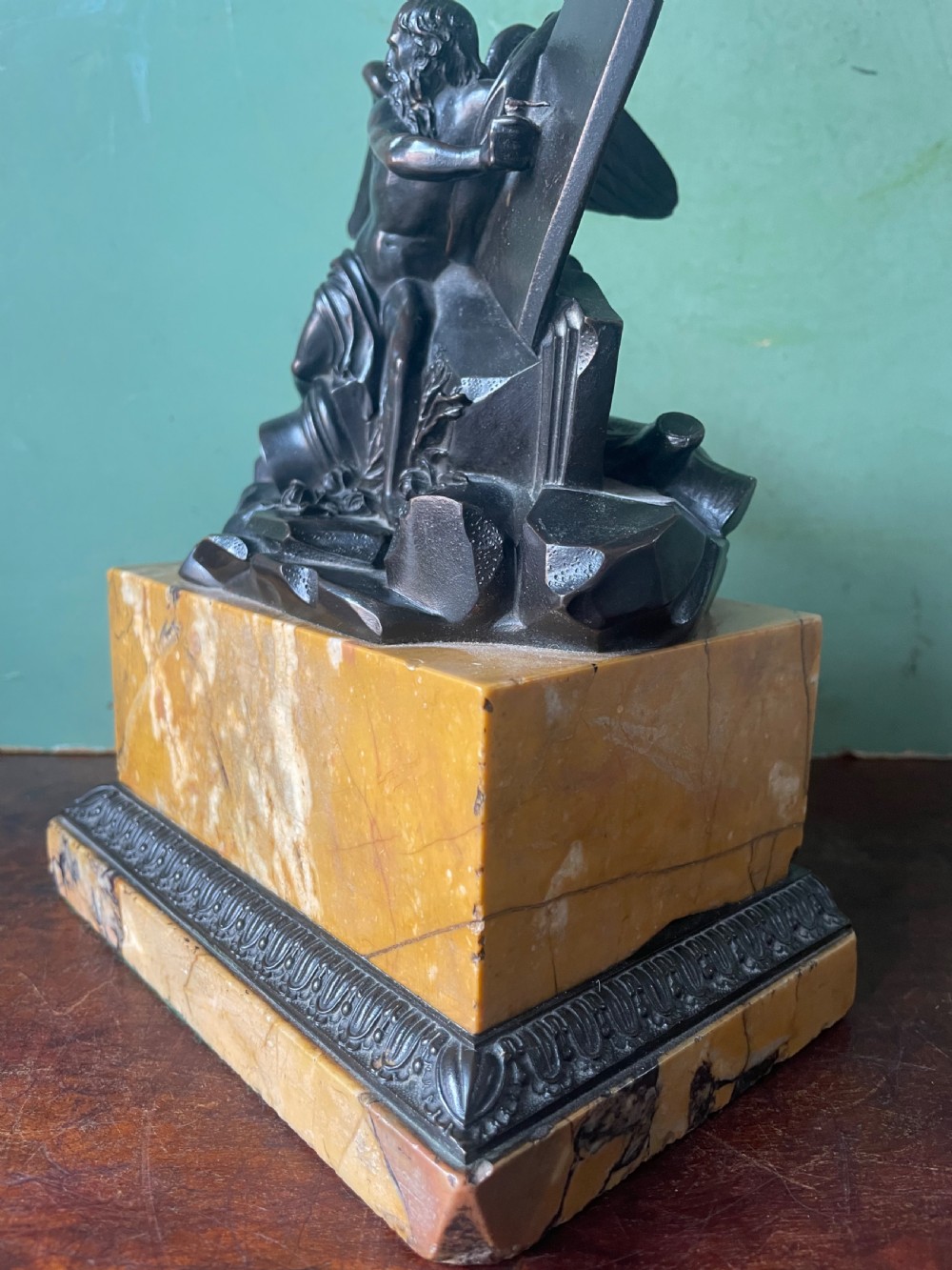 Early C19th French classical bronze study mounted on a ‘giallo di siena’ marble plinth base , probably depicting Chronos . View VIII