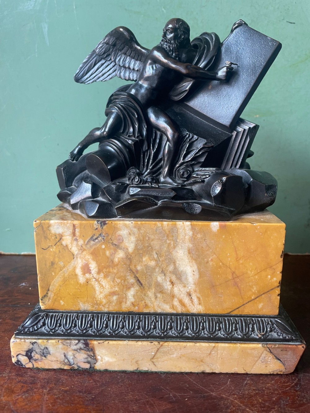 Early C19th French classical bronze study mounted on a ‘giallo di siena’ marble plinth base , probably depicting Chronos . View XII