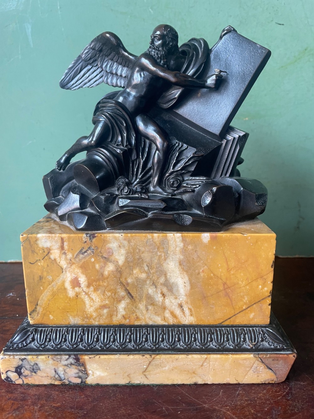 Early C19th French classical bronze study mounted on a ‘giallo di siena’ marble plinth base , probably depicting Chronos . View XV