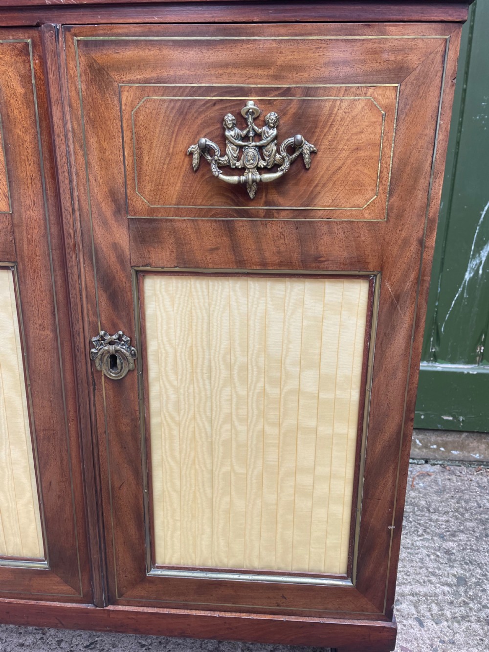 Elegant early C19th small-scale mahogany 4 door 2-part glazed cabinet having brass line inlay and brass mouldings , together with a ‘rosso levanto’ marble top. View V