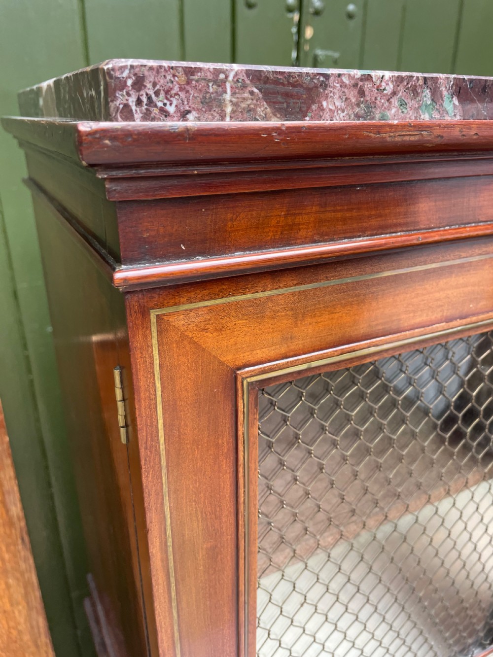 Elegant early C19th small-scale mahogany 4 door 2-part glazed cabinet having brass line inlay and brass mouldings , together with a ‘rosso levanto’ marble top. View VIII
