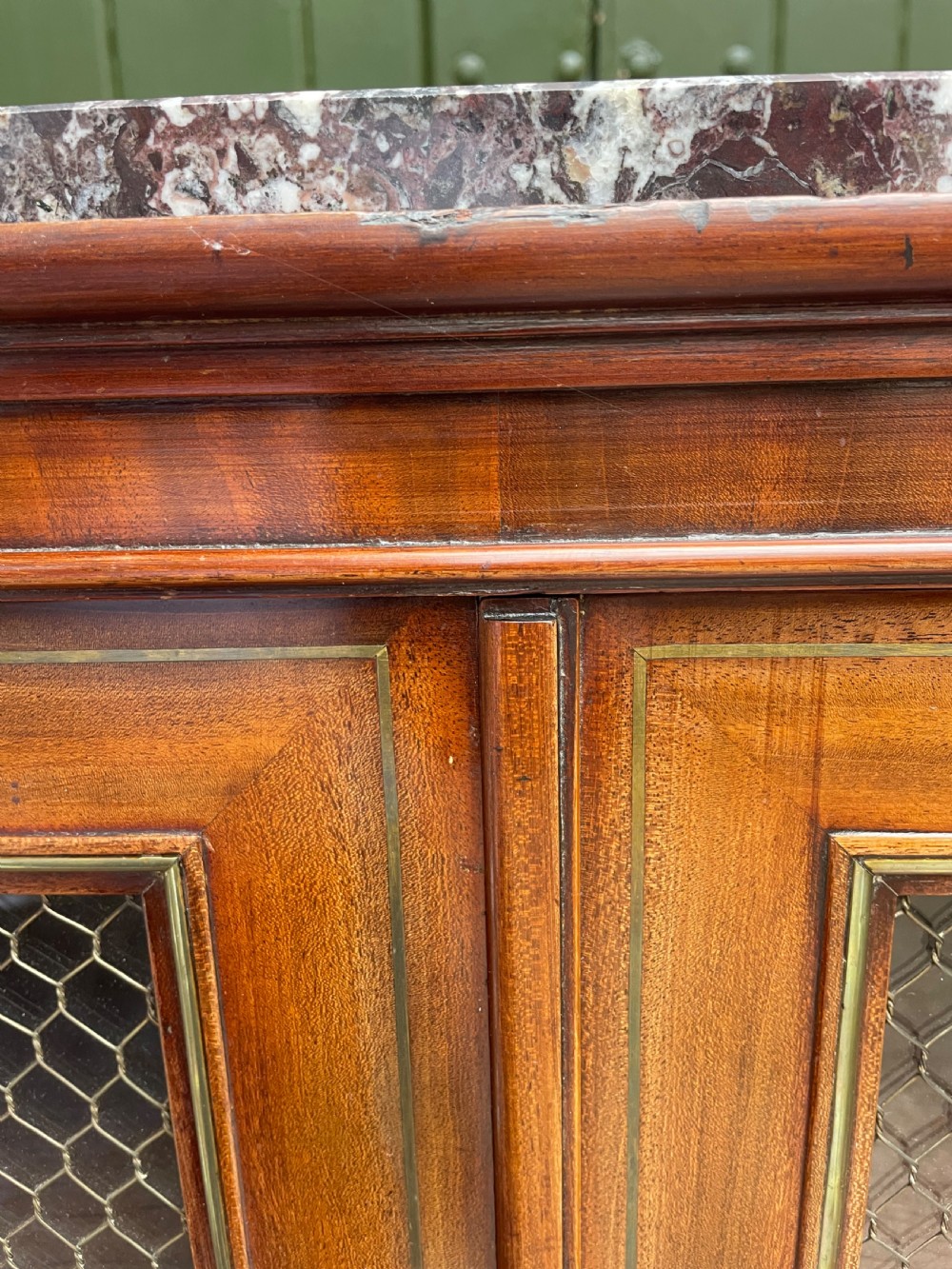 Elegant early C19th small-scale mahogany 4 door 2-part glazed cabinet having brass line inlay and brass mouldings , together with a ‘rosso levanto’ marble top. View XV