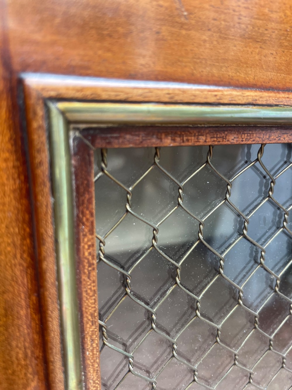 Elegant early C19th small-scale mahogany 4 door 2-part glazed cabinet having brass line inlay and brass mouldings , together with a ‘rosso levanto’ marble top. View XVI