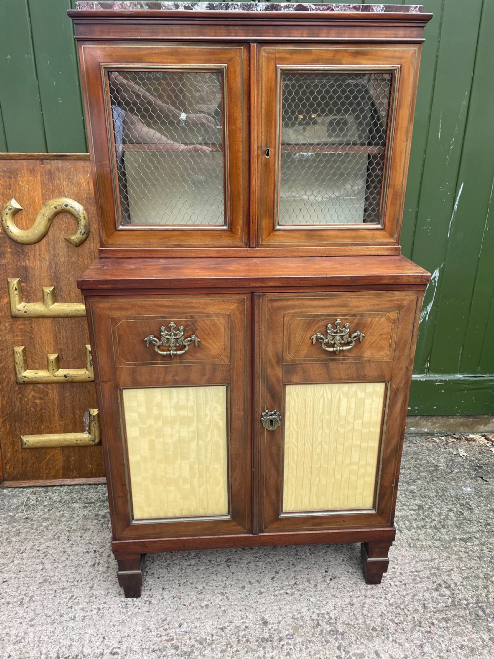 Elegant early C19th small-scale mahogany 4 door 2-part glazed cabinet having brass line inlay and brass mouldings , together with a ‘rosso levanto’ marble top. View XVII