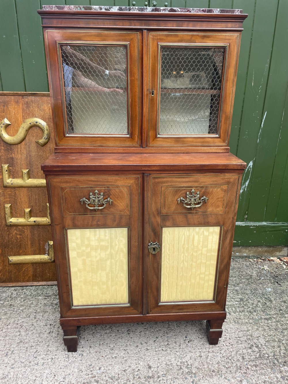 Elegant early C19th small-scale mahogany 4 door 2-part glazed cabinet having brass line inlay and brass mouldings , together with a ‘rosso levanto’ marble top. View XVIII