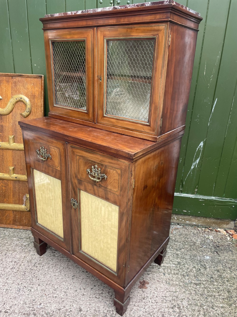 Elegant early C19th small-scale mahogany 4 door 2-part glazed cabinet having brass line inlay and brass mouldings , together with a ‘rosso levanto’ marble top. View XXII