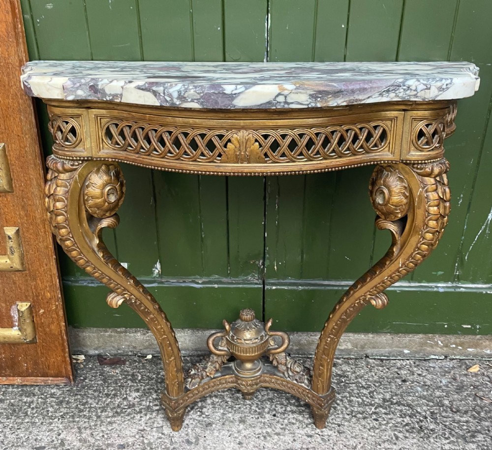 Mid C19th French carved gilt-wood console table of serpentine outline in the C18th Louis XVI period style.