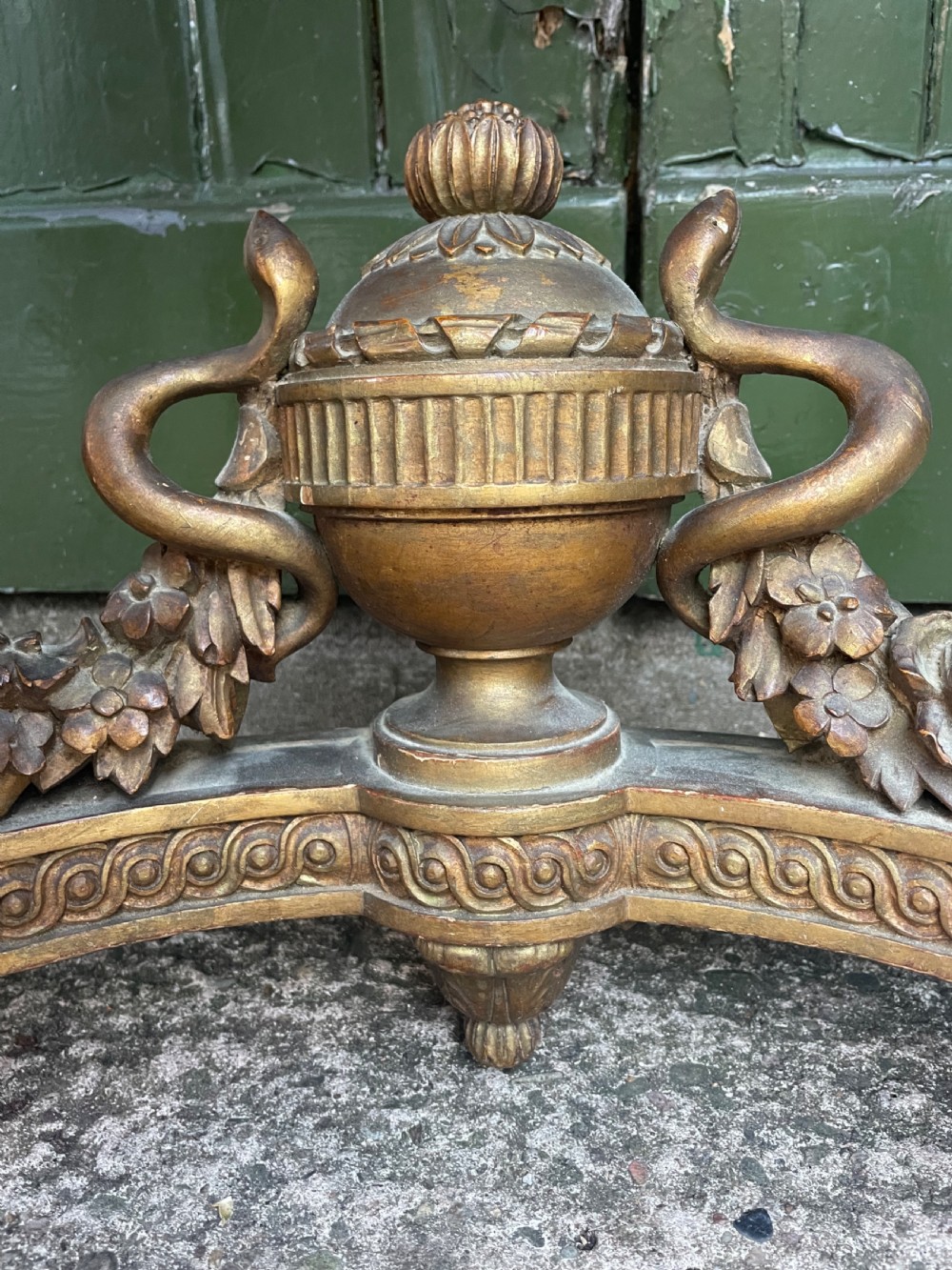 A 19th-century French giltwood console table featuring a serpentine variegated marble top, pierced lattice frieze, and carved urn stretcher. View XIV