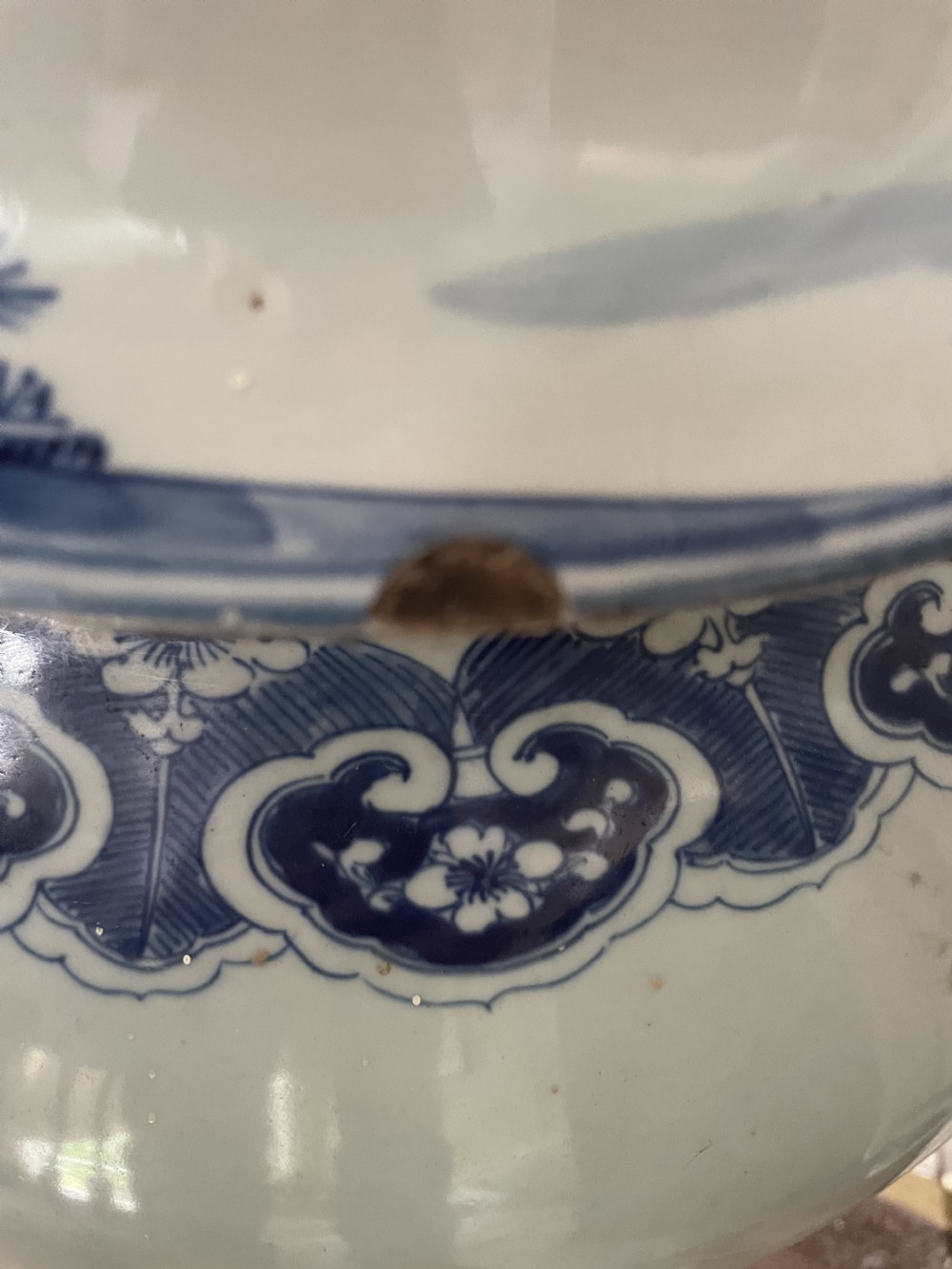 A large Qing dynasty style blue and white porcelain ginger jar with a domed lid decorated with hand-painted traditional Chinese landscape scenes. View XVII