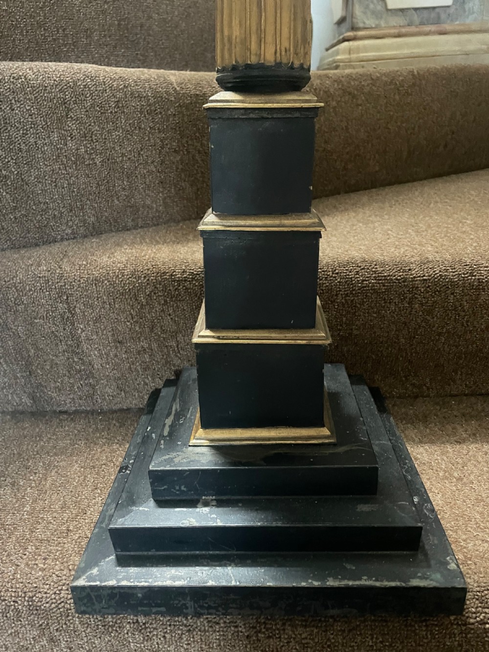 A set of three tall 19th-century graduated candlesticks featuring fluted gold-toned Corinthian columns on black stepped bases. View VII