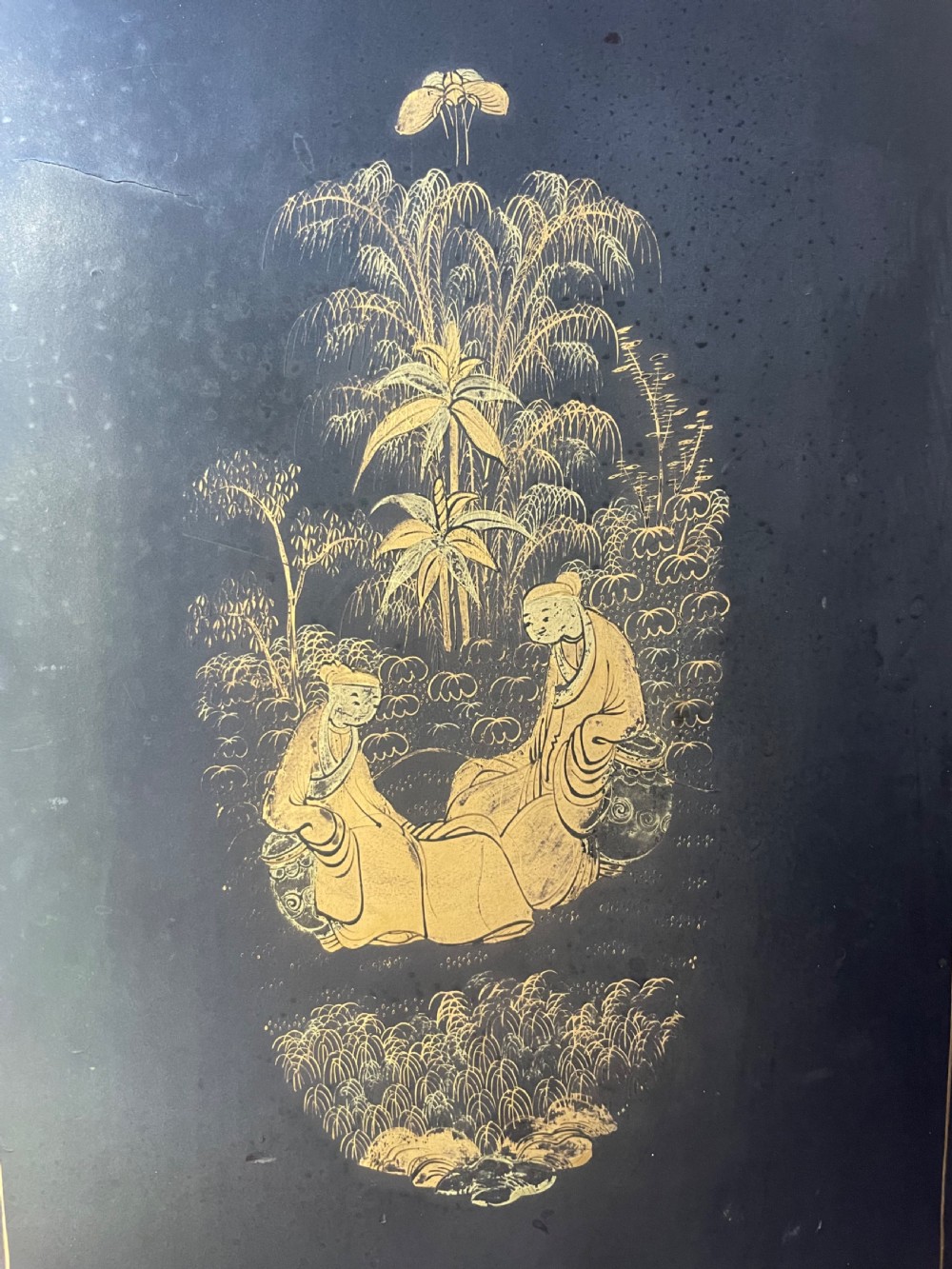 A mid-nineteenth century Chinese export black lacquer table cabinet featuring two doors decorated with gilded figural landscapes, floral borders, and geometric motifs. View XI