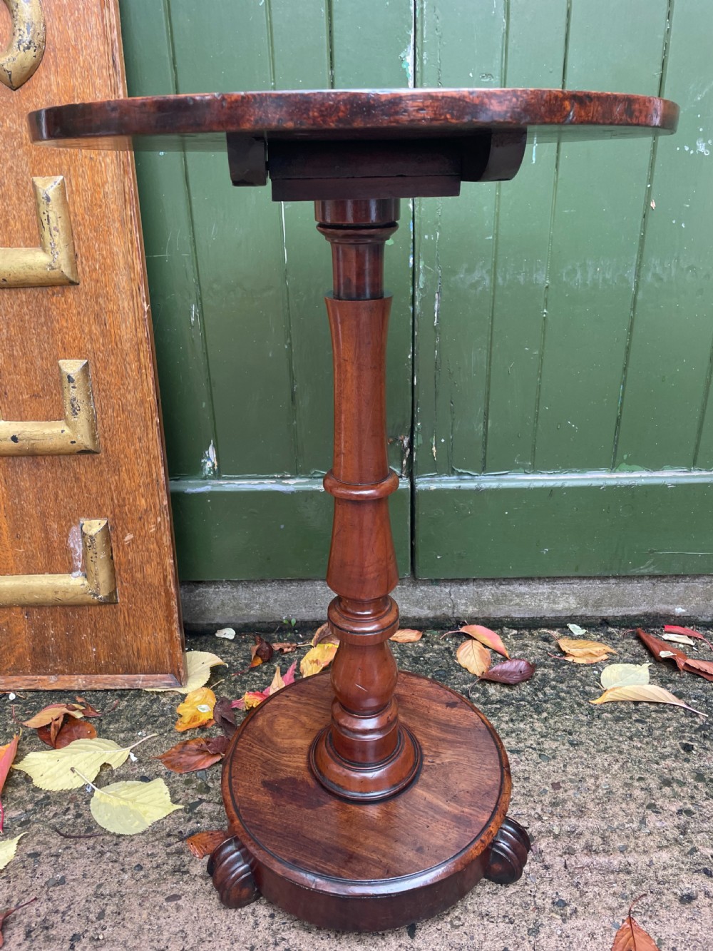 A 19th-century William IV circular occasional table featuring a geometric optical parquetry top set on a turned column stem and plinth base. View V