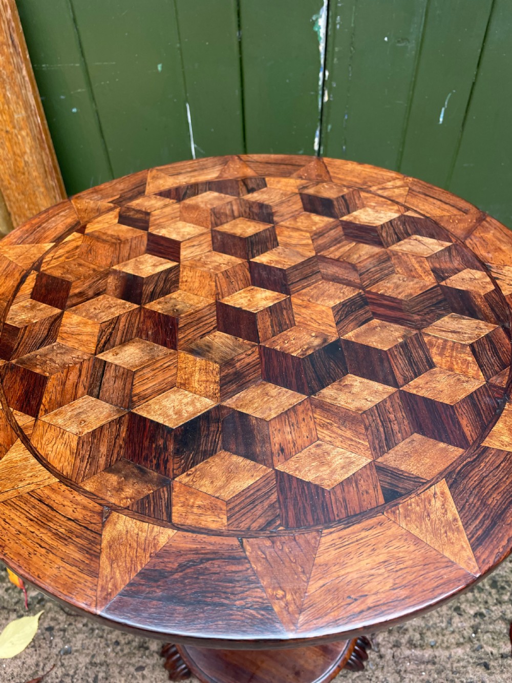 A 19th-century William IV circular occasional table featuring a geometric optical parquetry top set on a turned column stem and plinth base. View VI