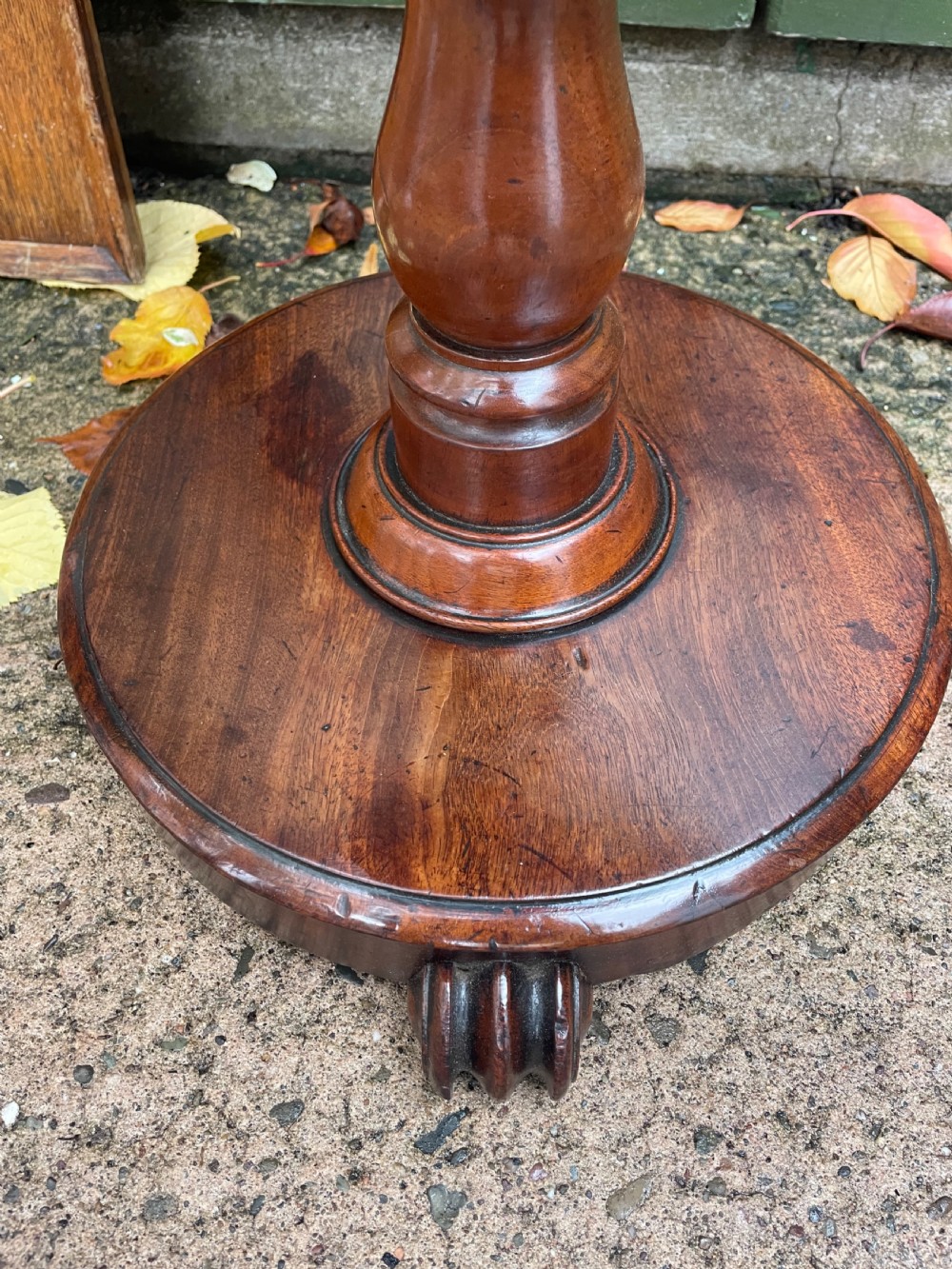 A 19th-century William IV circular occasional table featuring a geometric optical parquetry top set on a turned column stem and plinth base. View VII