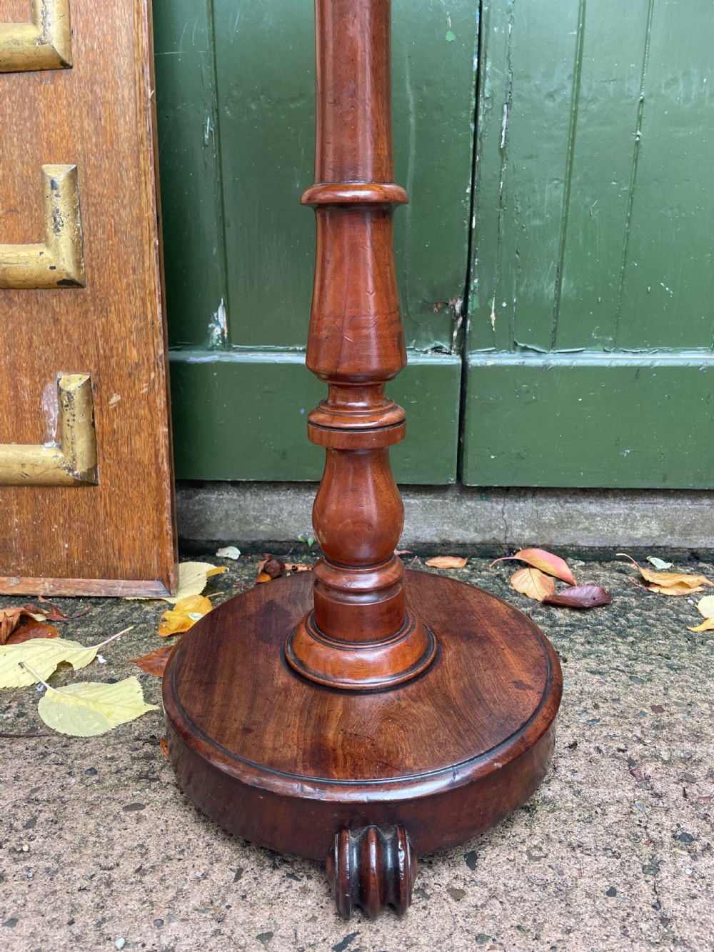 A 19th-century William IV circular occasional table featuring a geometric optical parquetry top set on a turned column stem and plinth base. View IX