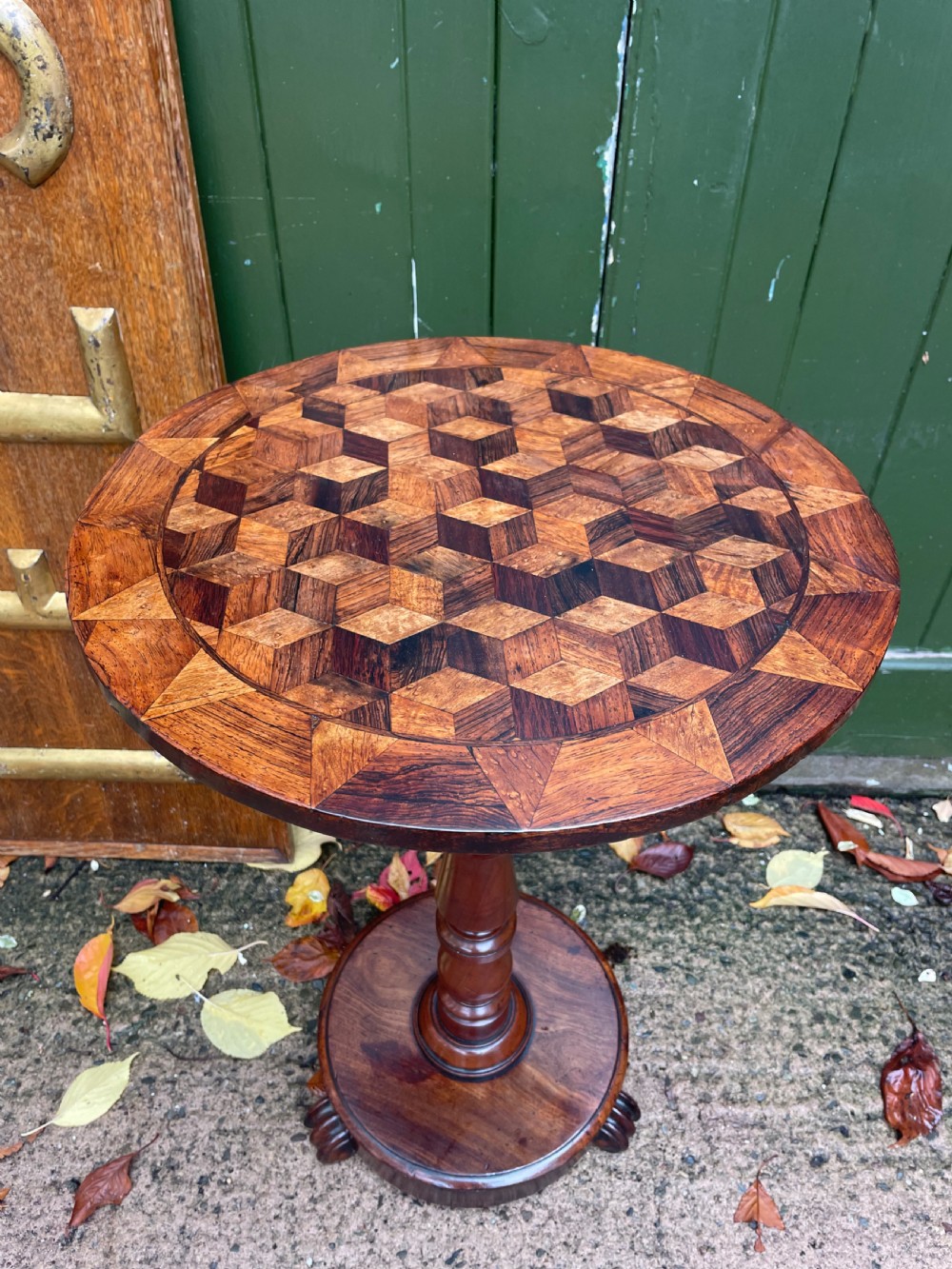 A 19th-century William IV circular occasional table featuring a geometric optical parquetry top set on a turned column stem and plinth base. View XI