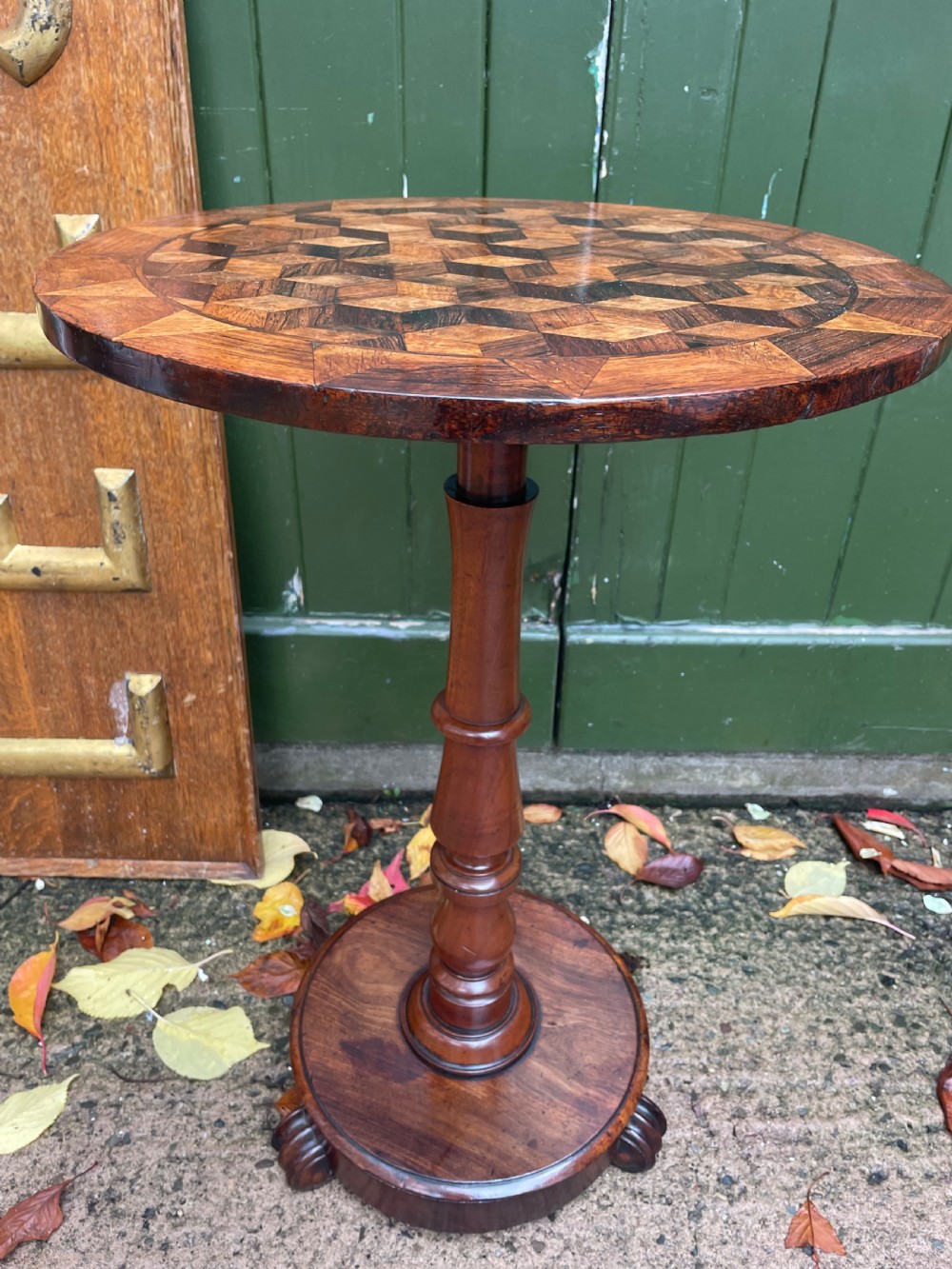 A 19th-century William IV circular occasional table featuring a geometric optical parquetry top set on a turned column stem and plinth base. View XIII