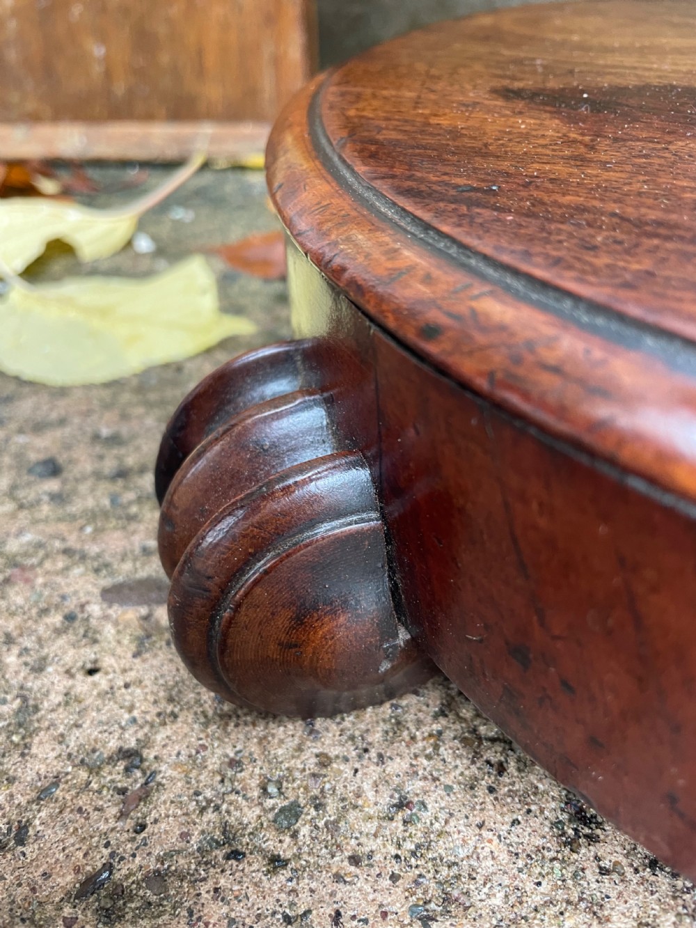 A 19th-century William IV circular occasional table featuring a geometric optical parquetry top set on a turned column stem and plinth base. View XIV