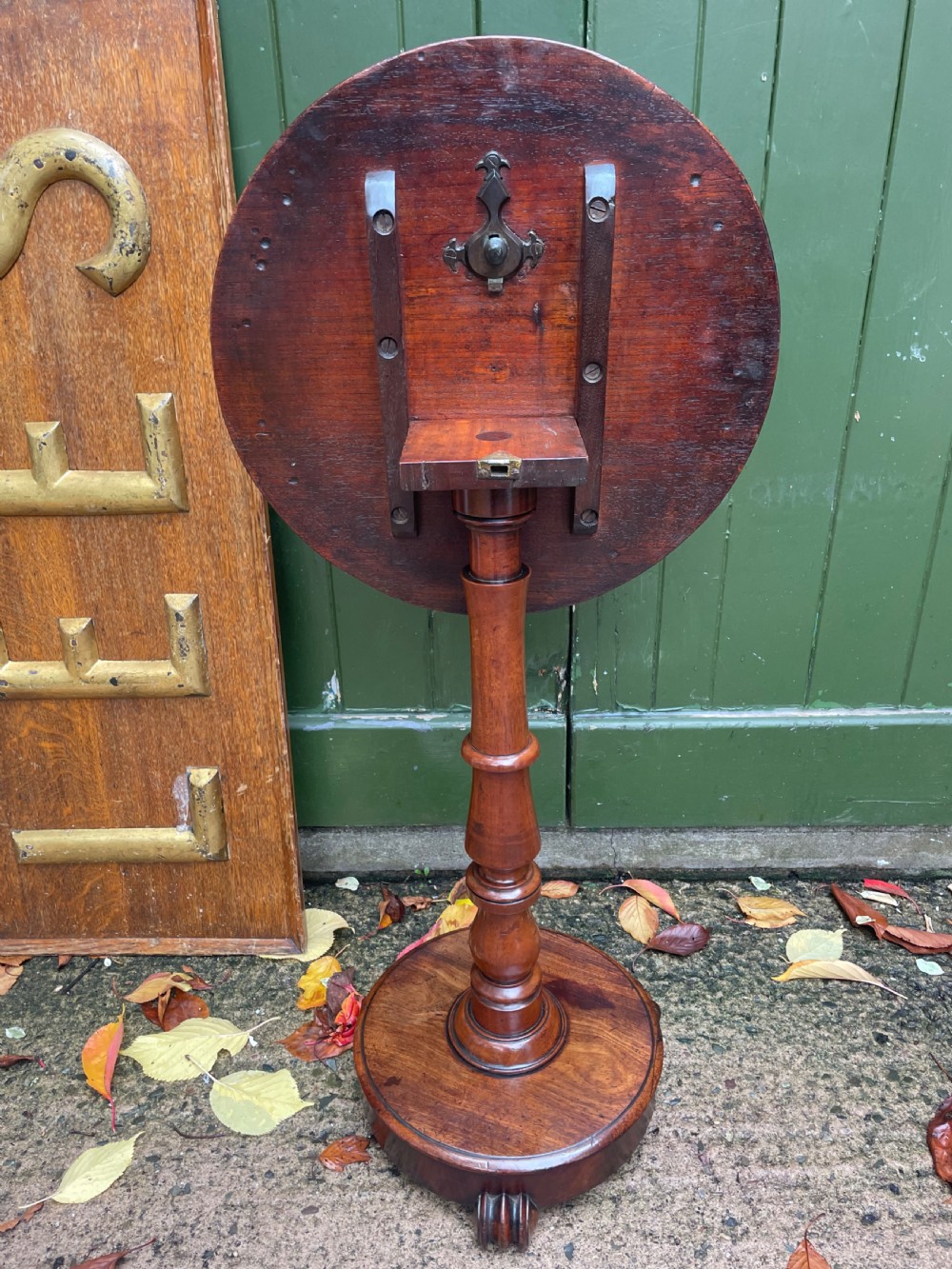 A 19th-century William IV circular occasional table featuring a geometric optical parquetry top set on a turned column stem and plinth base. View XVI