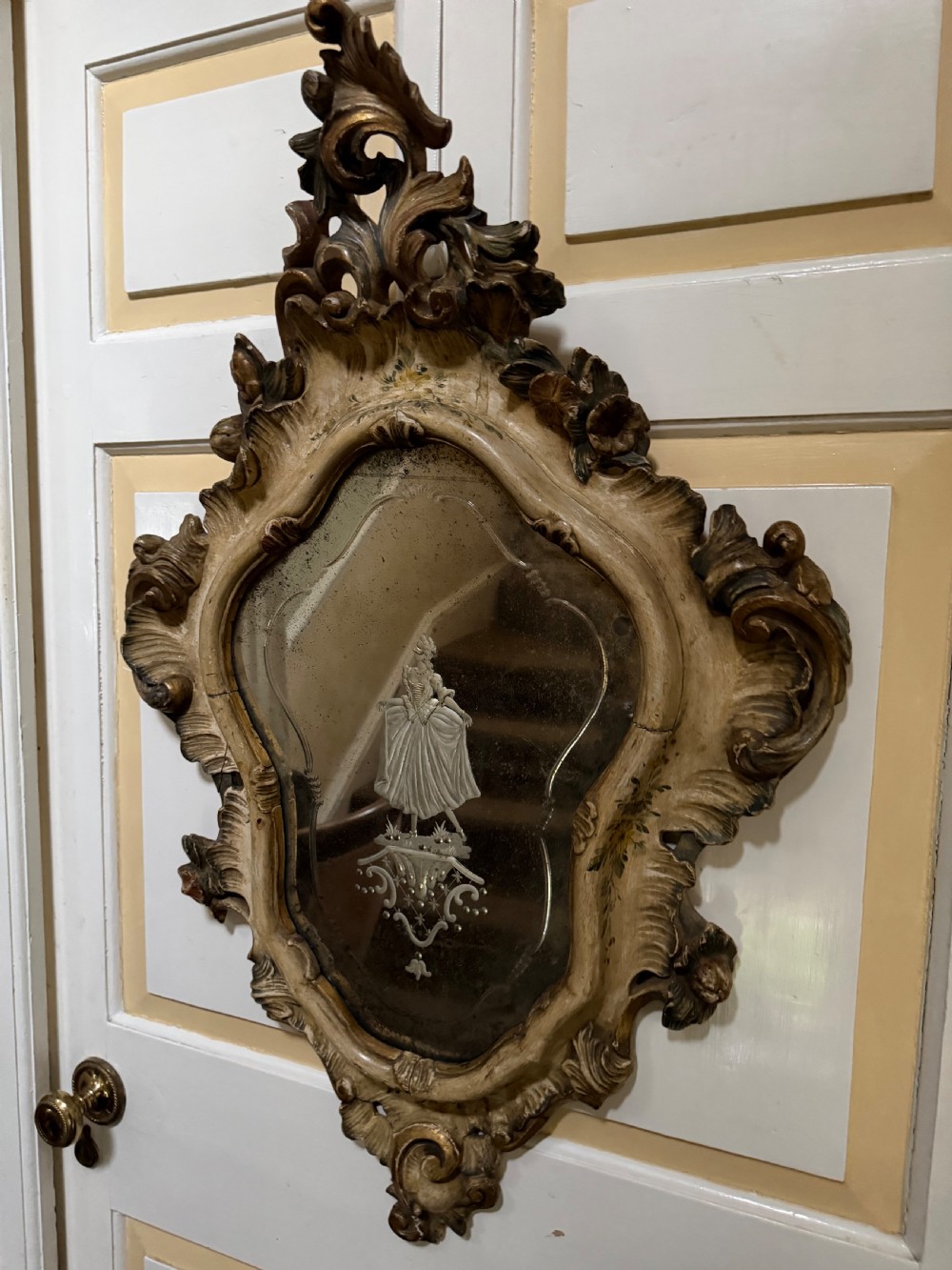 A pair of 19th-century Italian Venetian Rococo style wall mirrors featuring carved giltwood and polychrome frames surrounding etched glass depicting figures. View III