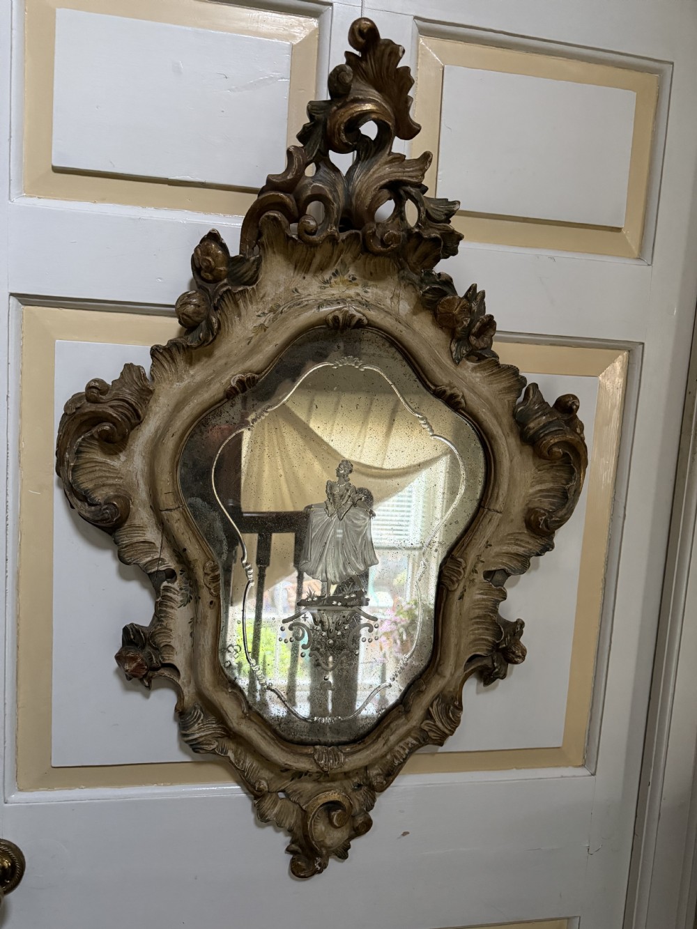 A pair of 19th-century Italian Venetian Rococo style wall mirrors featuring carved giltwood and polychrome frames surrounding etched glass depicting figures. View VII