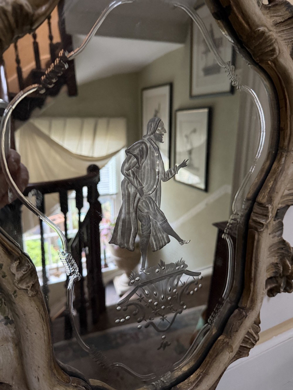 A pair of 19th-century Italian Venetian Rococo style wall mirrors featuring carved giltwood and polychrome frames surrounding etched glass depicting figures. View XII