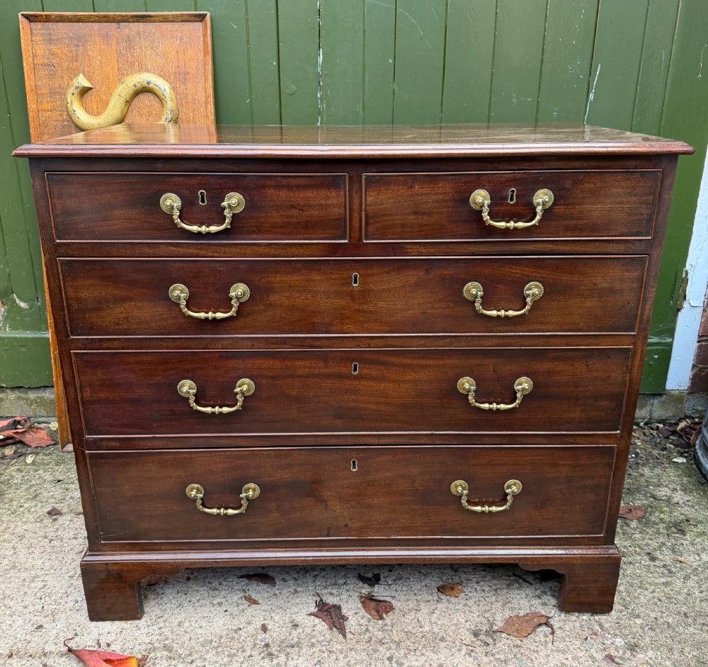 C18th George III Chippendale period mahogany chest of drawers of small scale and proportions.