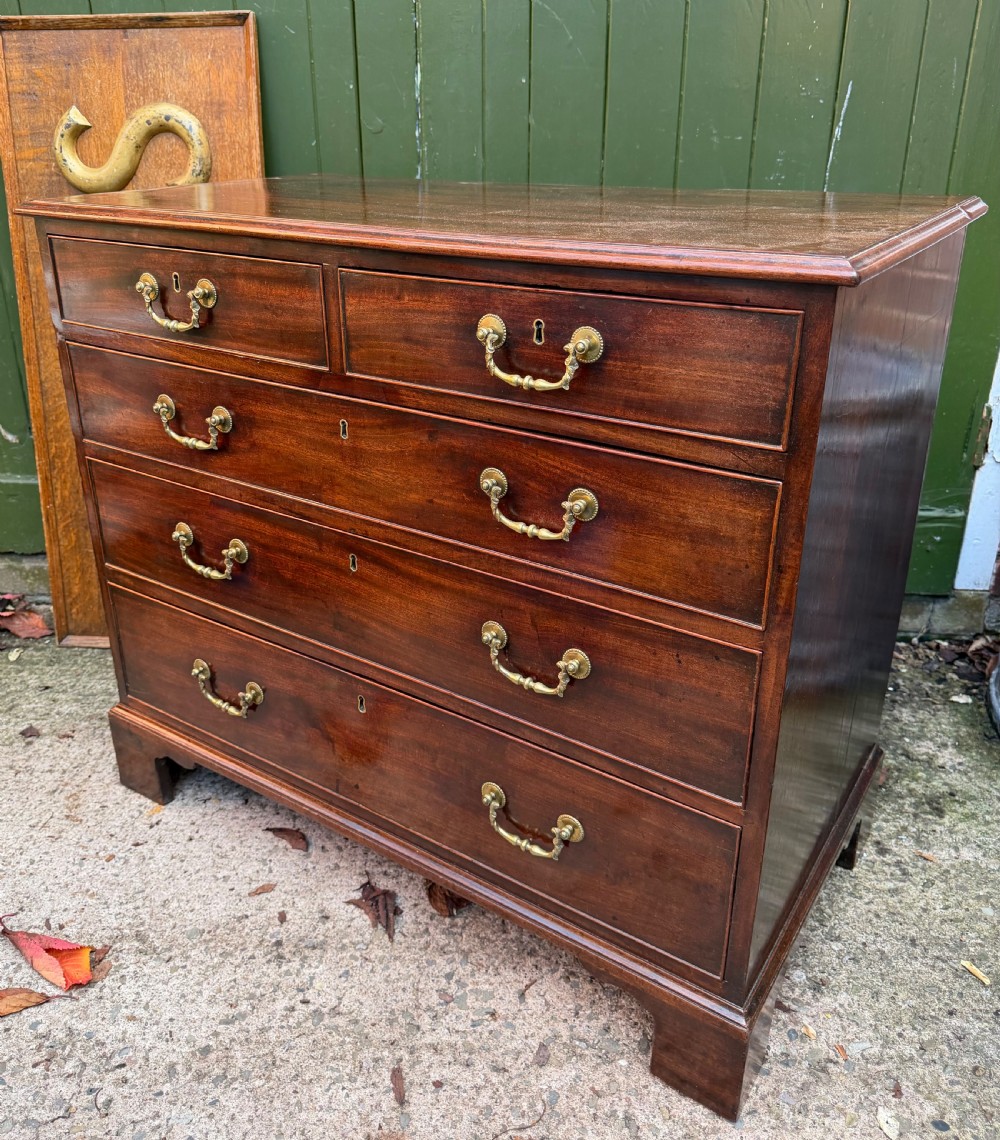 C18th George III Chippendale period mahogany chest of drawers of small scale and proportions. View III
