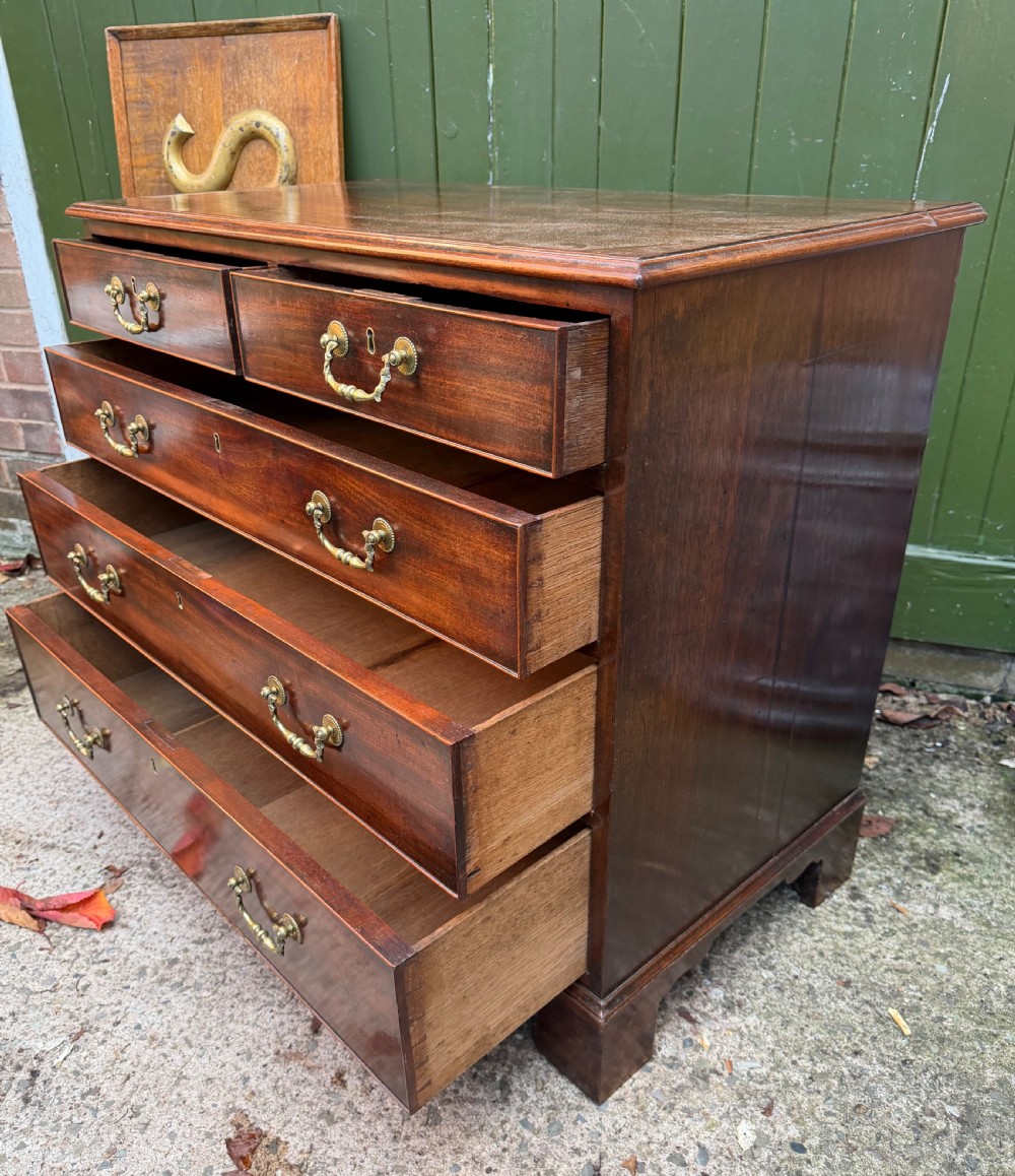 C18th George III Chippendale period mahogany chest of drawers of small scale and proportions. View IX