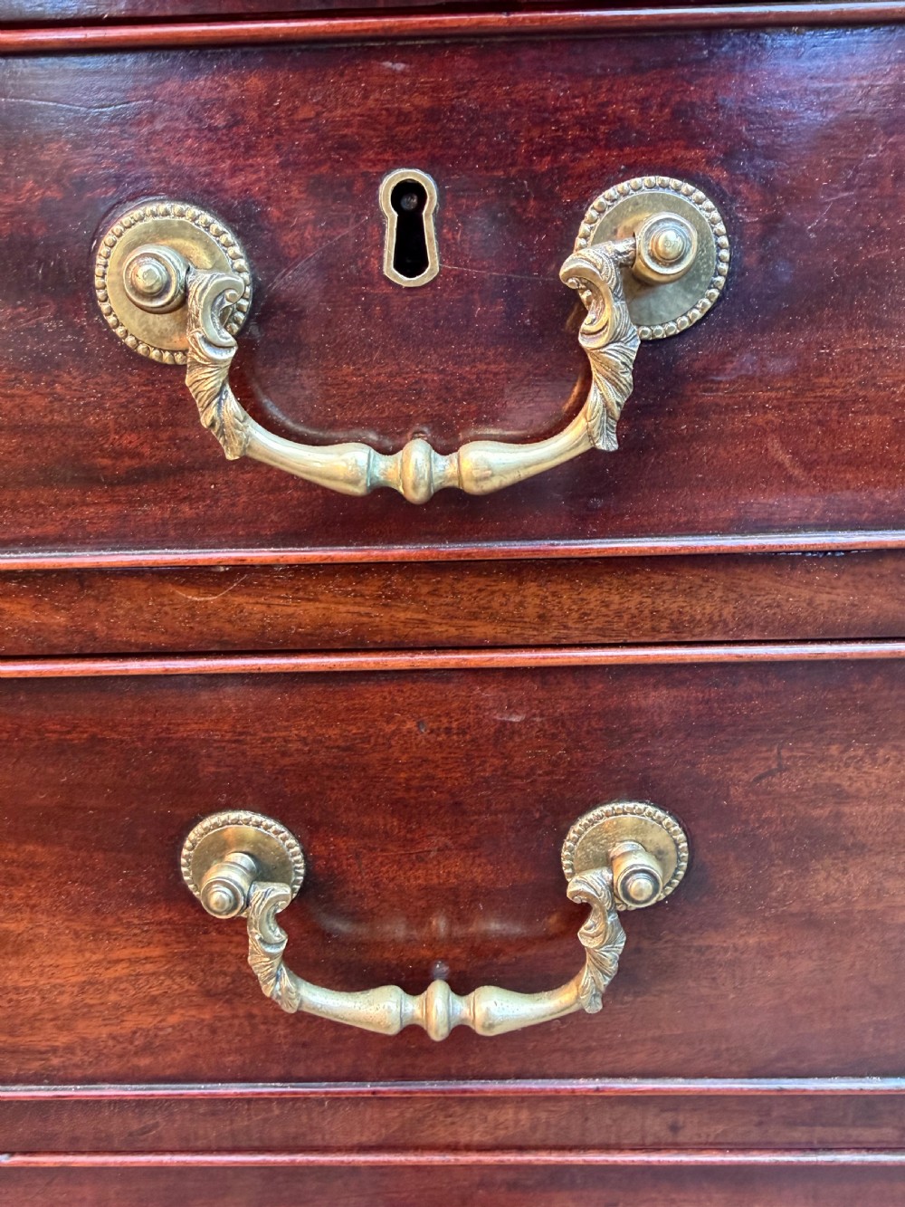 C18th George III Chippendale period mahogany chest of drawers of small scale and proportions. View XI