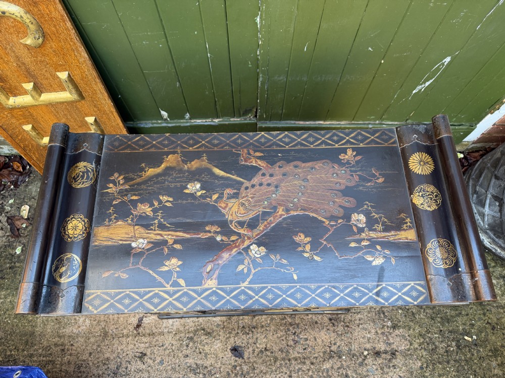 Late nineteenth-century Japanese Meiji period black lacquer shodana cabinet-on-stand with gold maki-e pictorial panels, asymmetrical shelves, and engraved metal fitments. View XX