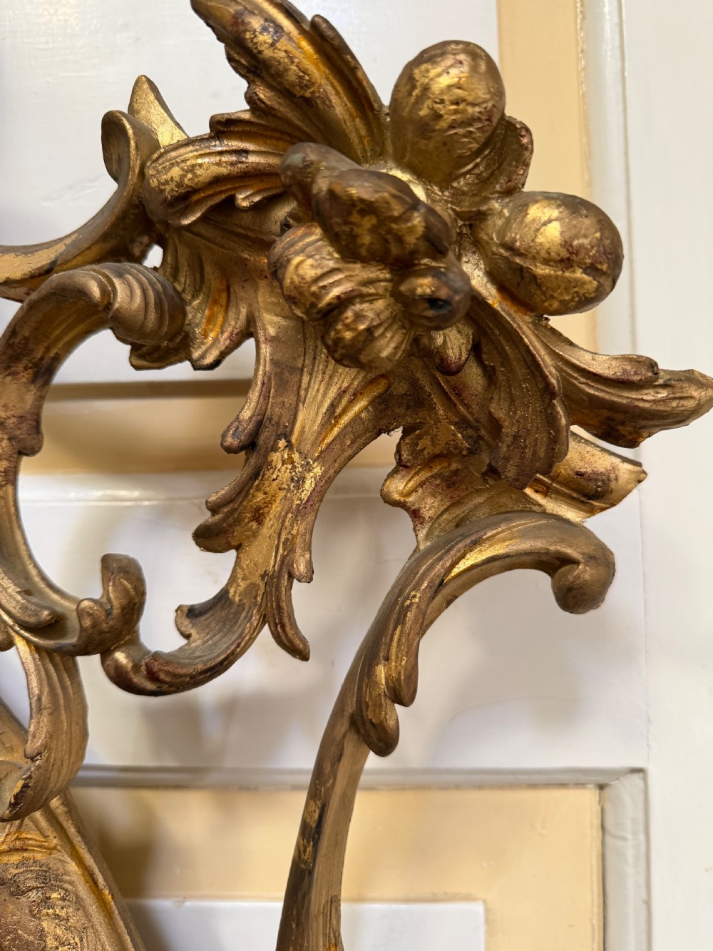 Flamboyant early C20th carved gilt-wood and composition rococo-style framed oval mirror of C18th period design in the manner of Thomas Chippendale. View IV