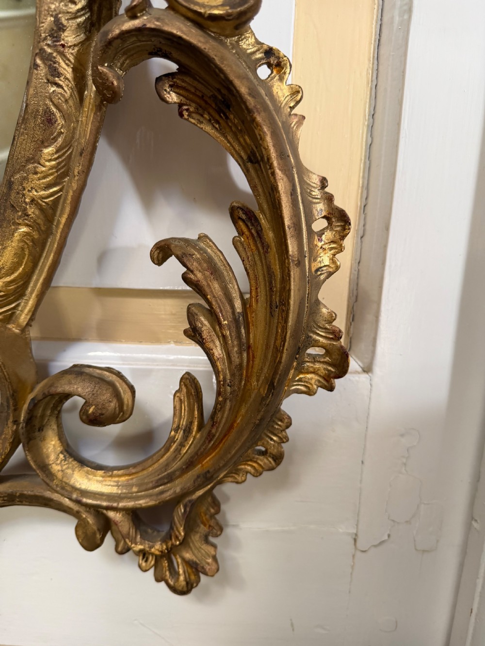 Flamboyant early C20th carved gilt-wood and composition rococo-style framed oval mirror of C18th period design in the manner of Thomas Chippendale. View V