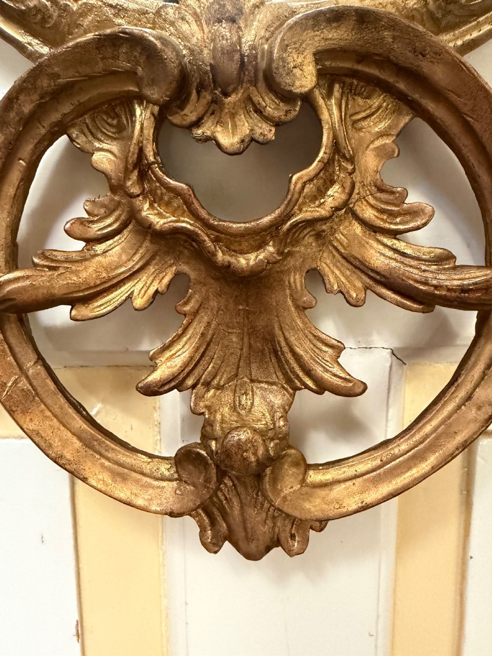 Flamboyant early C20th carved gilt-wood and composition rococo-style framed oval mirror of C18th period design in the manner of Thomas Chippendale. View VIII