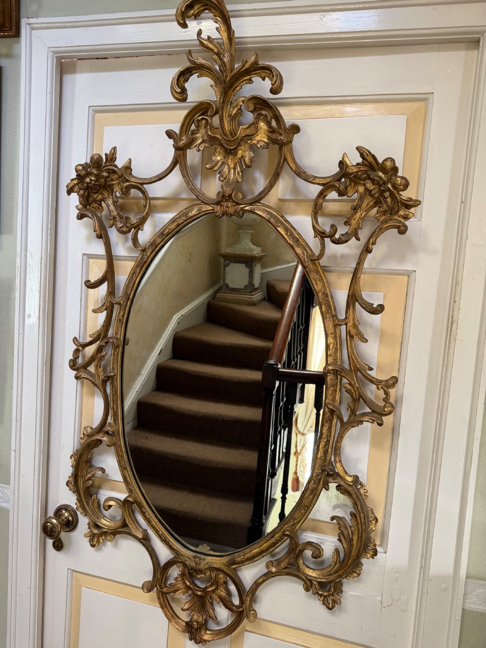 Flamboyant early C20th carved gilt-wood and composition rococo-style framed oval mirror of C18th period design in the manner of Thomas Chippendale. View X