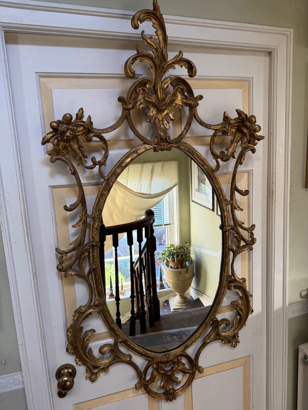 Flamboyant early C20th carved gilt-wood and composition rococo-style framed oval mirror of C18th period design in the manner of Thomas Chippendale. View XI