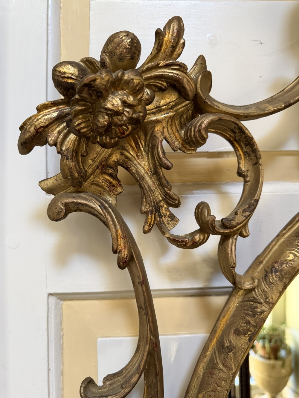 Flamboyant early C20th carved gilt-wood and composition rococo-style framed oval mirror of C18th period design in the manner of Thomas Chippendale. View VI