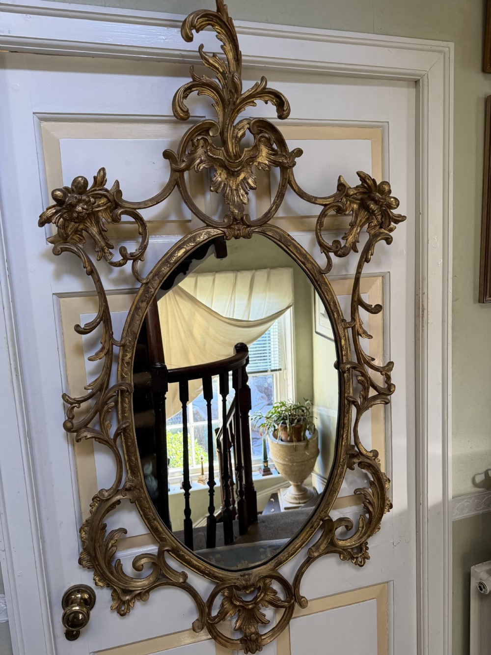 Flamboyant early C20th carved gilt-wood and composition rococo-style framed oval mirror of C18th period design in the manner of Thomas Chippendale. View XIV