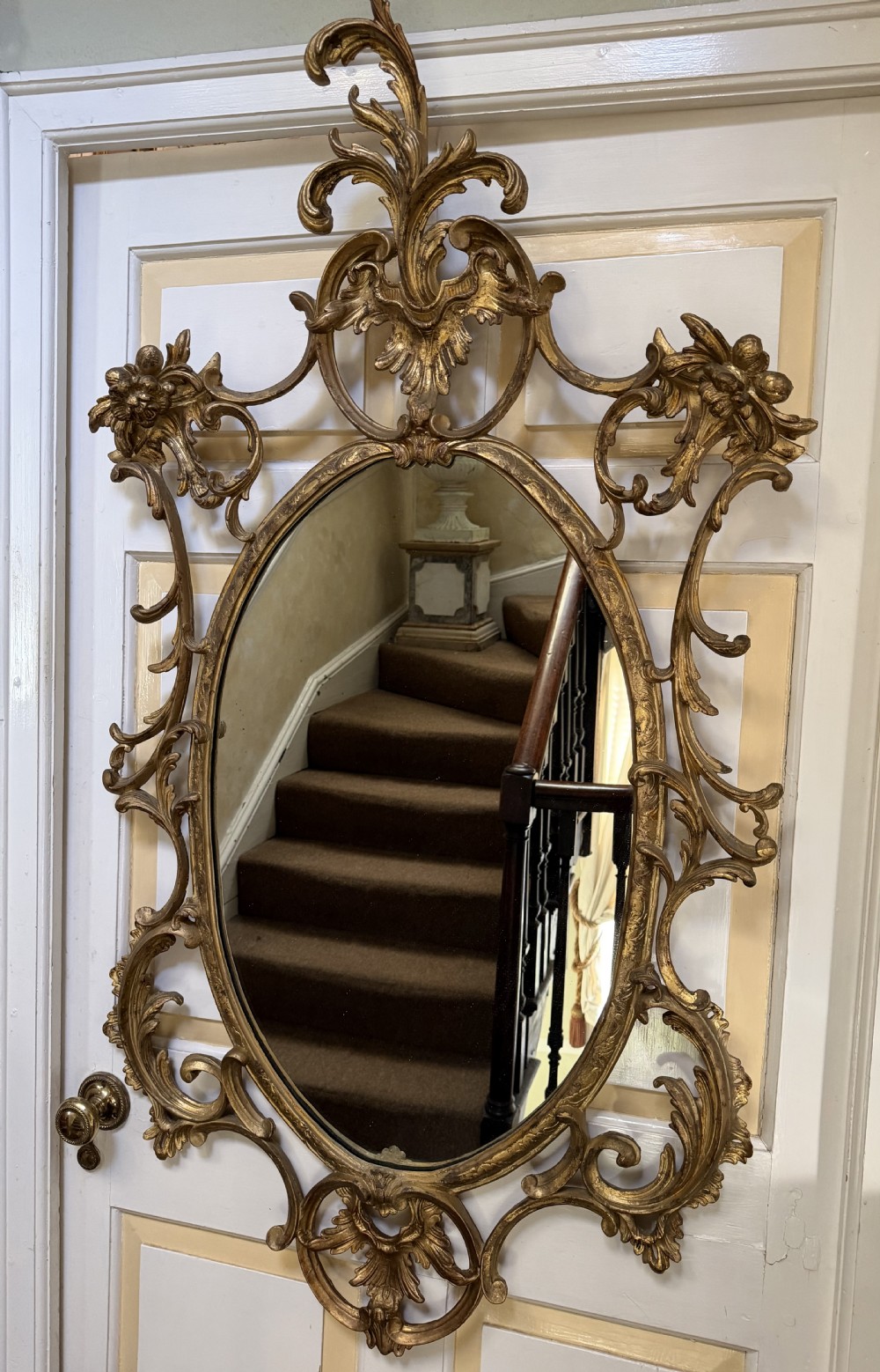Flamboyant early C20th carved gilt-wood and composition rococo-style framed oval mirror of C18th period design in the manner of Thomas Chippendale. View XX