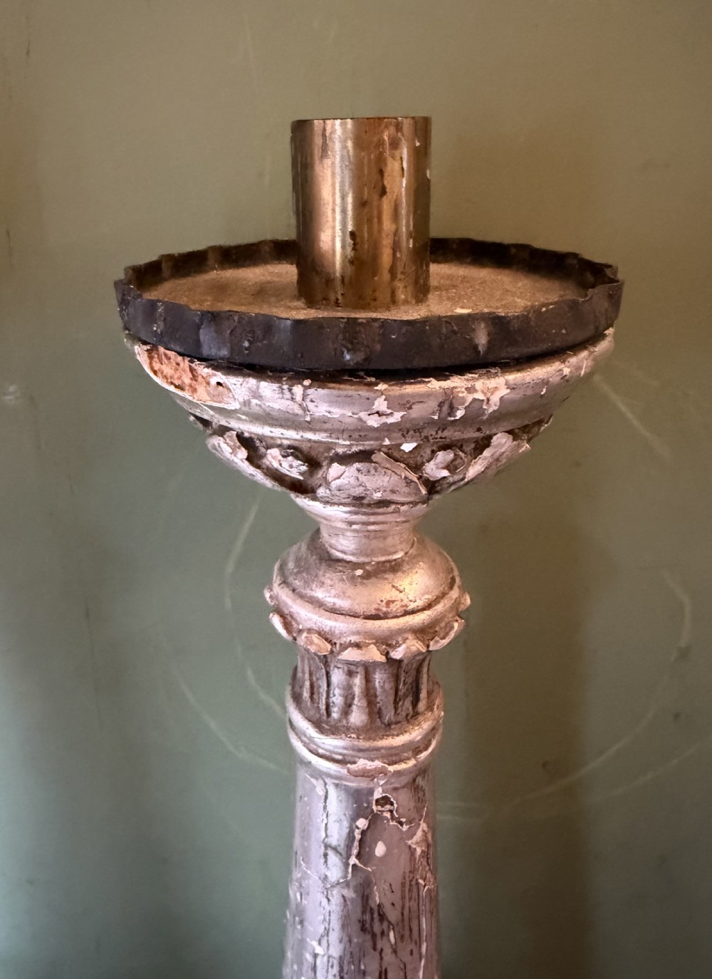 Pair of tall, hand-carved wooden altar candlesticks with an aged silver leaf finish, leaf motifs, and architectural bases. View VII