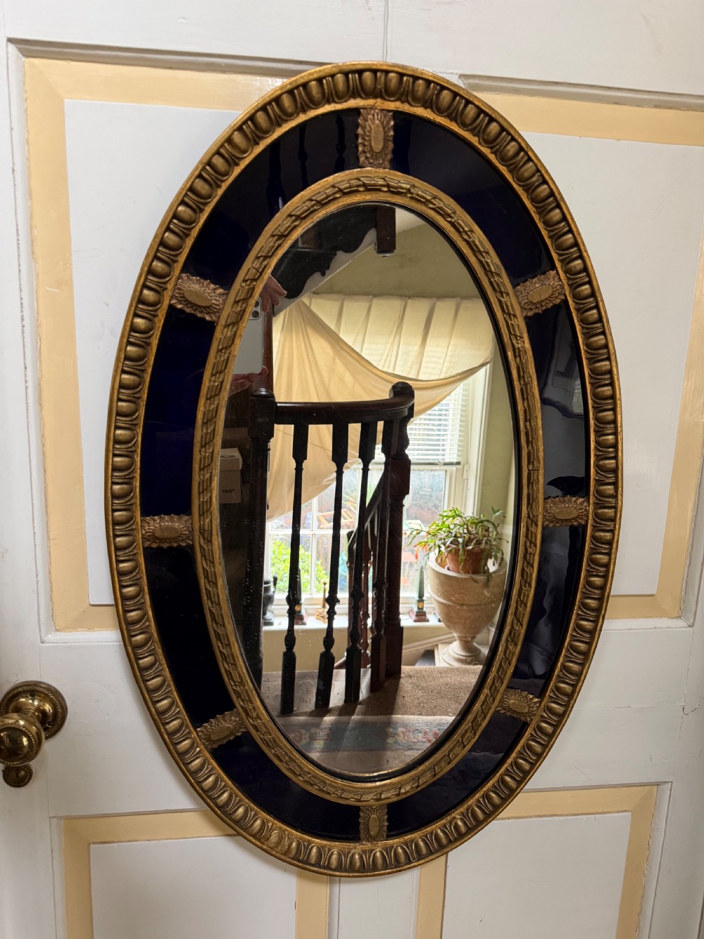 Decorative early C20th blue border glass oval gilt-wood framed mirror in the late C18th style . View III