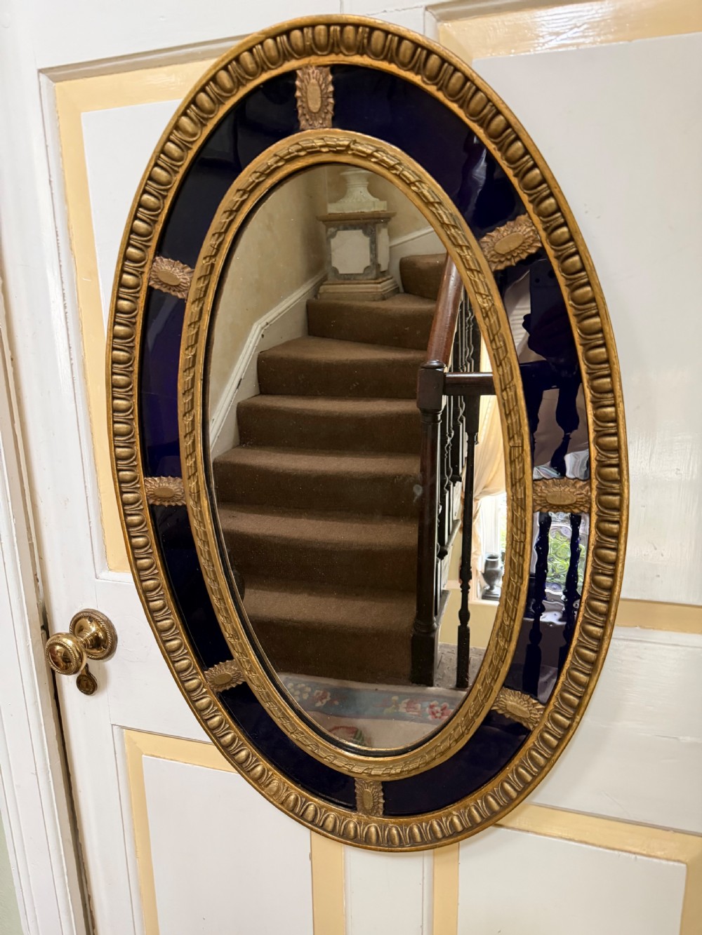 Decorative early C20th blue border glass oval gilt-wood framed mirror in the late C18th style . View V
