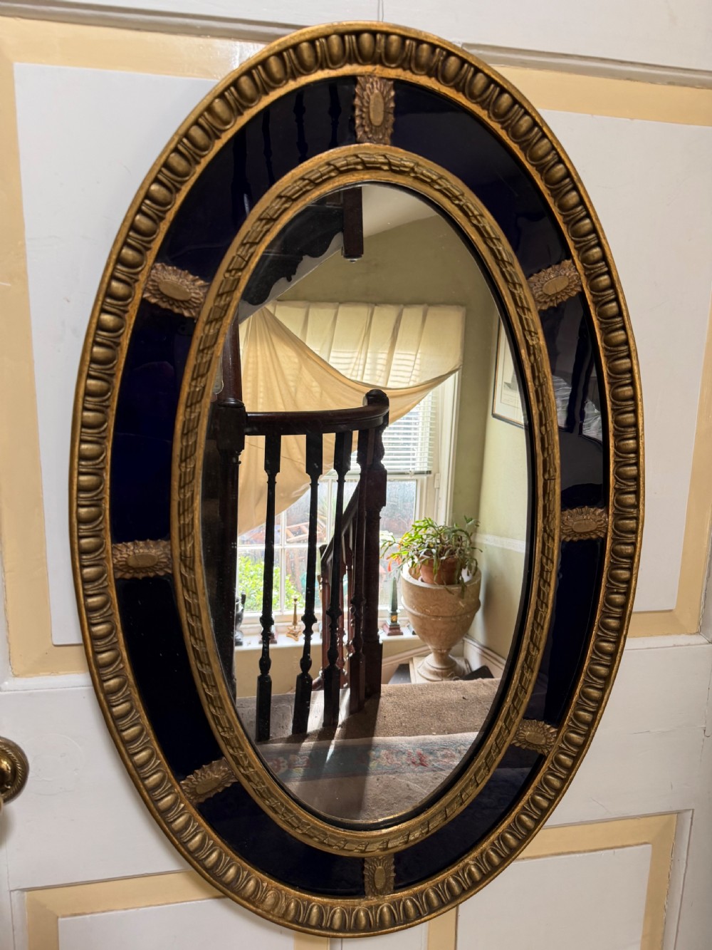 Decorative early C20th blue border glass oval gilt-wood framed mirror in the late C18th style . View IX