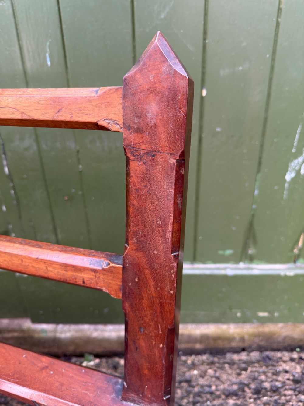 A mid-19th century mahogany luggage stand with a slatted platform, turned front legs, and a raised raked rear upstand. View XIV