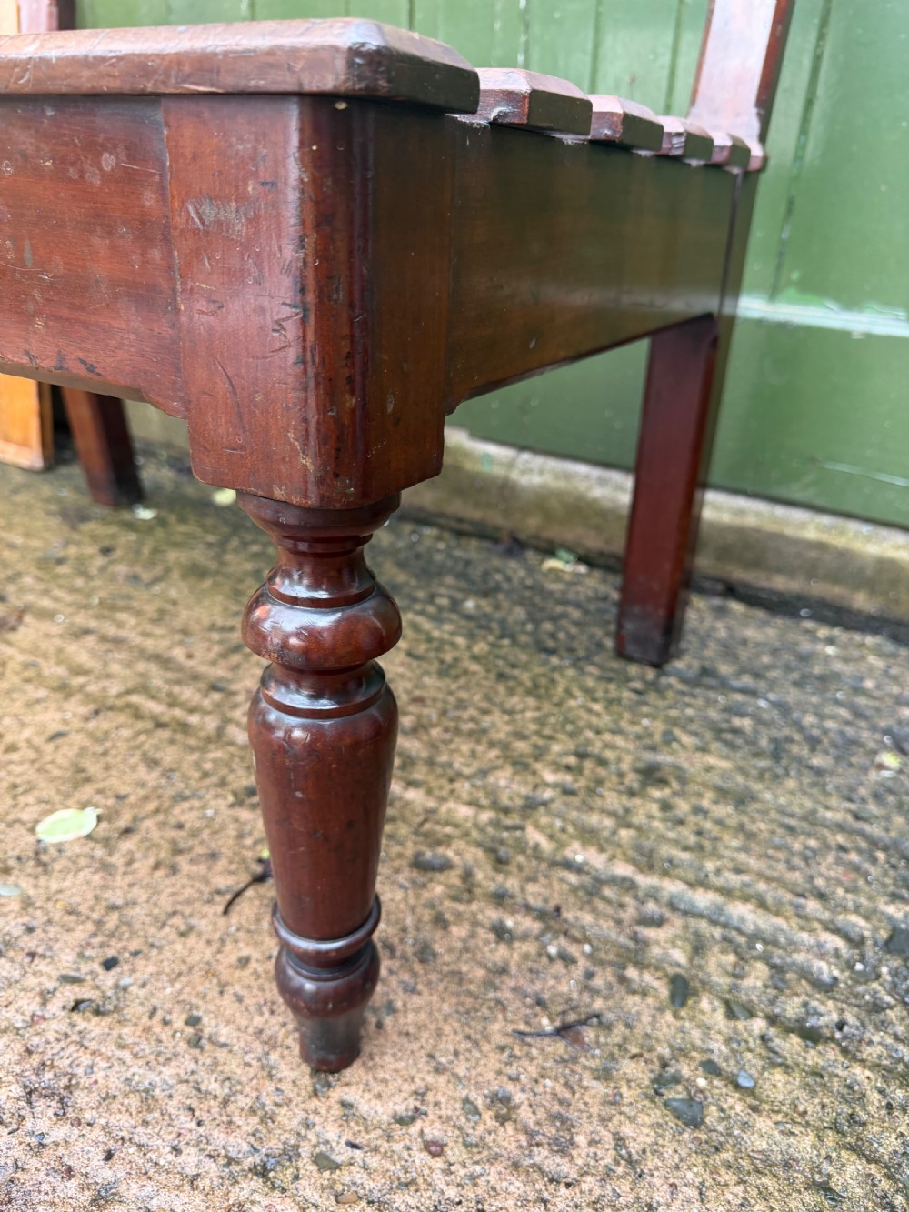 A mid-19th century mahogany luggage stand with a slatted platform, turned front legs, and a raised raked rear upstand. View XIX