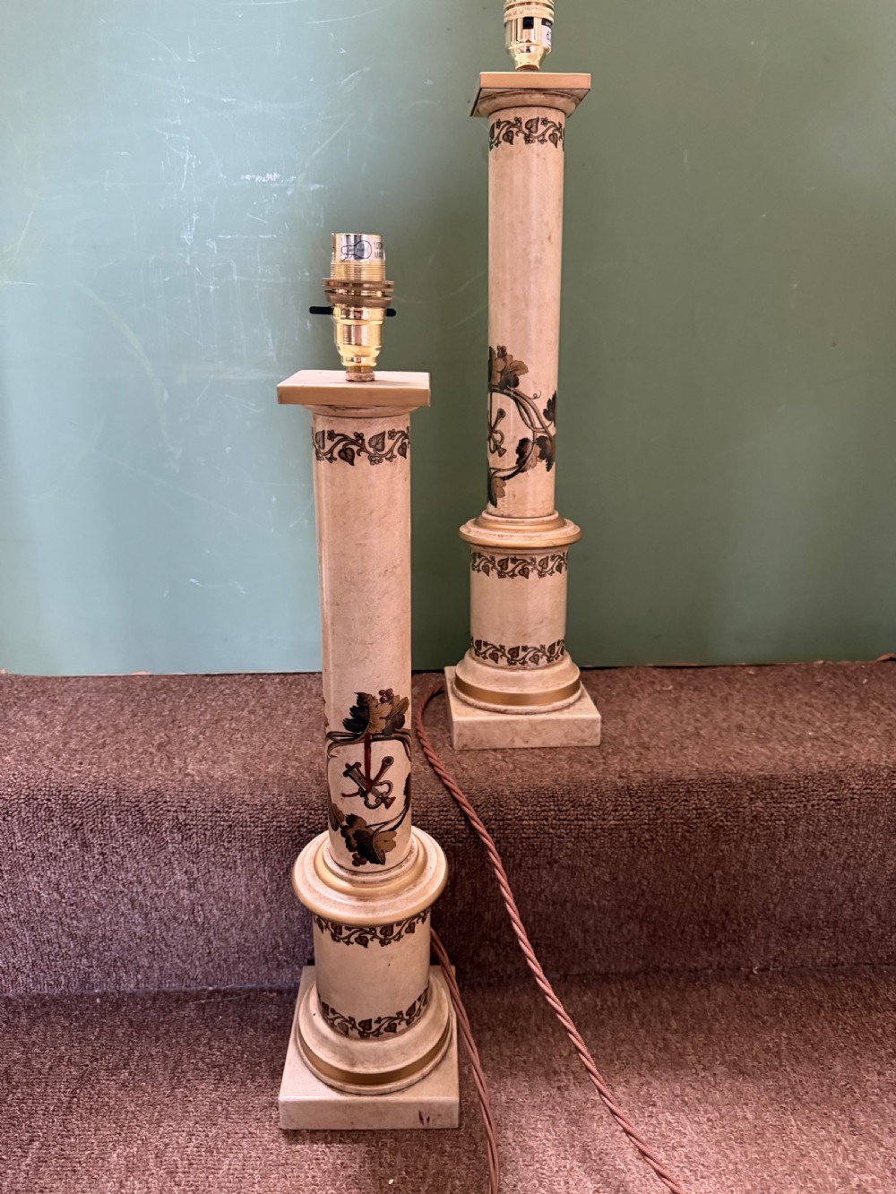 A pair of early twentieth-century French cream tole-peinte column table lamps decorated with hand-painted vine leaves, musical motifs, and gilt trim. View VII