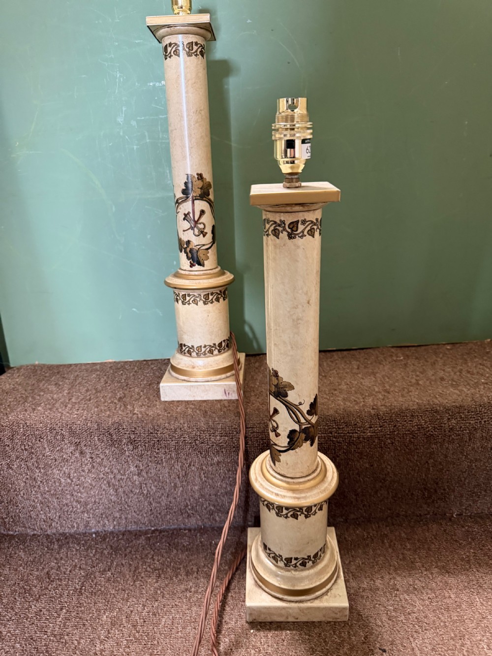 A pair of early twentieth-century French cream tole-peinte column table lamps decorated with hand-painted vine leaves, musical motifs, and gilt trim. View VIII