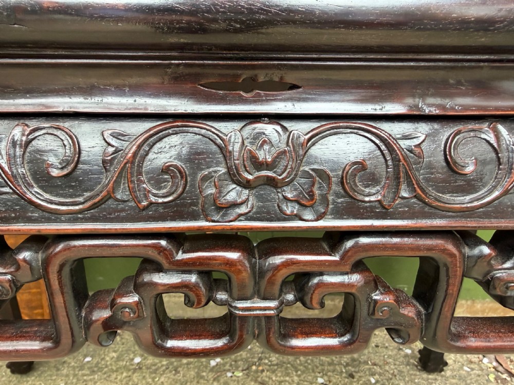 Late 19th-century Chinese Qing Dynasty dark hardwood centre table featuring an inset pink rouge marble rectangular top and intricately carved fretwork aprons. View VI