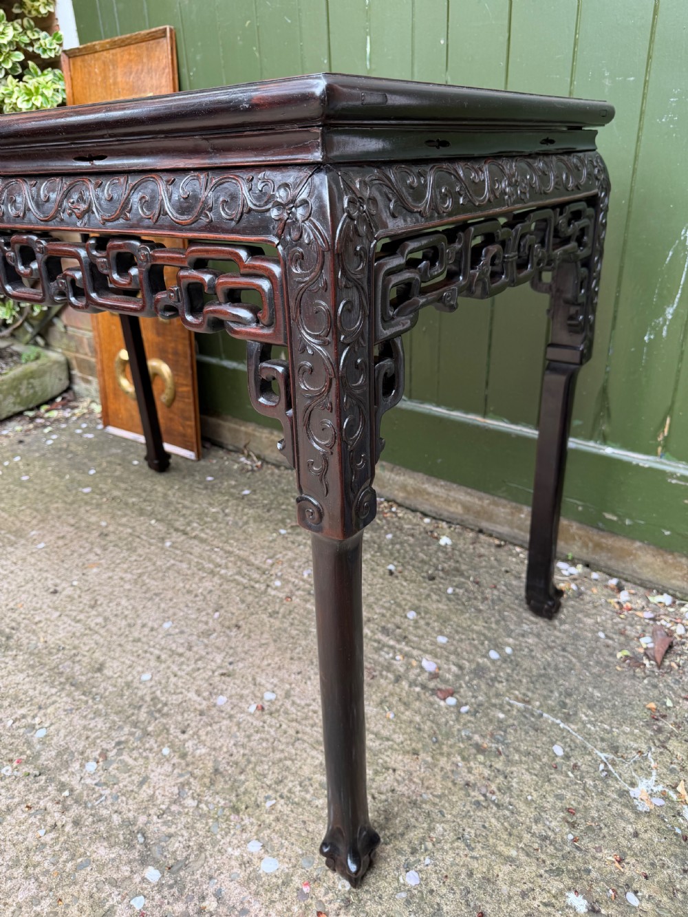 Late 19th-century Chinese Qing Dynasty dark hardwood centre table featuring an inset pink rouge marble rectangular top and intricately carved fretwork aprons. View VII